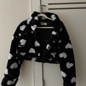 Black cropped jacket with white hearts